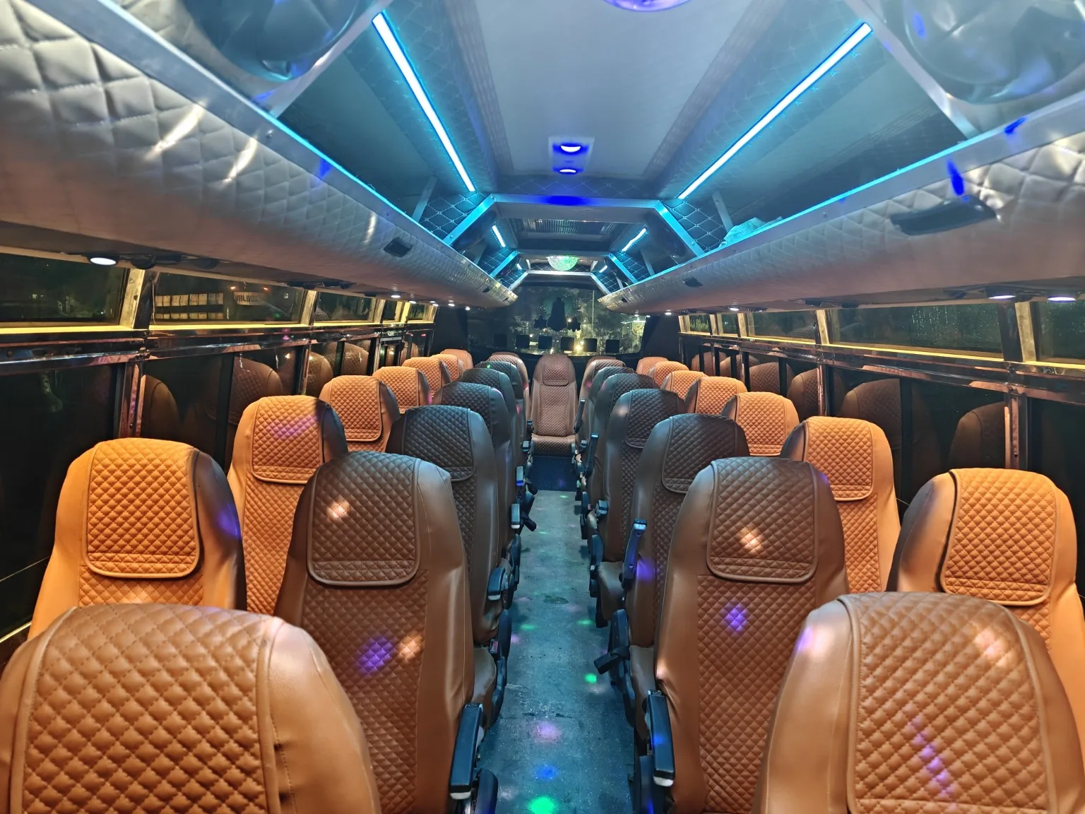 Luxury coach seating with blue accent lighting